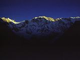 206 Fang , Annapurna I, Central, East, Roc Noir At Sunrise From Annapurna Sanctuary Base Camp I watched the rising sun illuminate more and more of the mountains for over an hour from Annapurna Sanctuary Base Camp. Here is a view from Fang to Annapurna Main (8091m), Central (8051m), and East (8026m) summits and the 7.5km long ridge to Roc Noir (7485m). In 1984, the Swiss climbers Erhard Loretan and Norbert Joos climbed the Roc Noir, crossed the east ridge to Annapurna and then down the north face. Roc Noir was first climbed on May 9, 1969 by the Germans Reinhold Obster, Pit Schubert, and Karl Winkler.